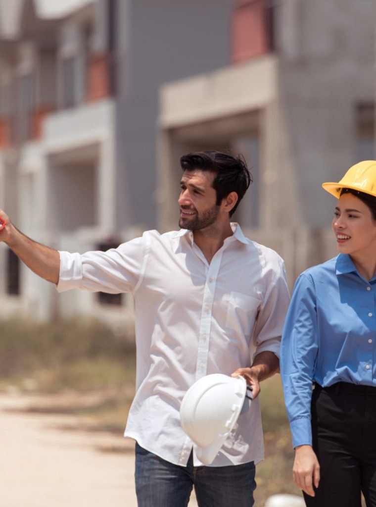 Architects and engineers work together to assess the residential Architects and engineers work together to assess the residential home construction site's progress